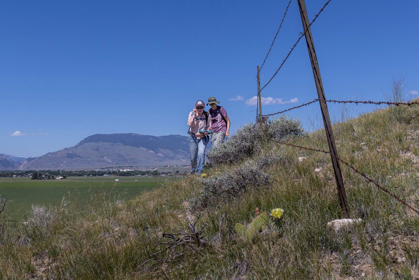 An Image of two naturalists doing field training north of Cody on June 27, 2022.